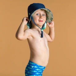 Chapeau Anti UV Bébé Réversible Bleu Et Imprimé Palmiers -Le Surf Boutique chapeau anti uv bebe reversible bleu et imprime palmiers 2